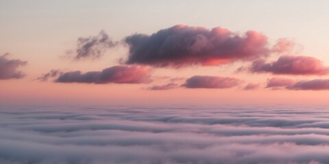 Fototapeta premium Colorful sunset clouds over a sea of fog.