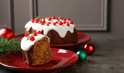 Traditional classic Christmas cake and decor on gray textured table