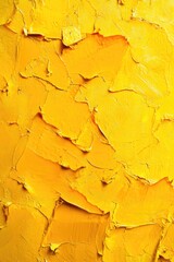 Close-up of a yellow painted wall with smooth texture and slight brush strokes