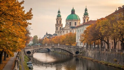 Obraz premium A scenic urban canal lined with historic buildings and trees in vibrant autumn colors, under soft evening light. A peaceful and picturesque cityscape full of seasonal charm.