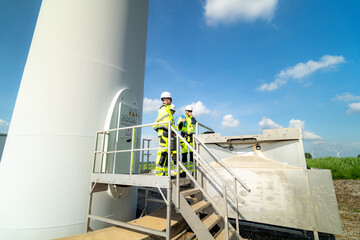 A group of  workers in high-visibility gear joyfully high-fives each other after completing their...