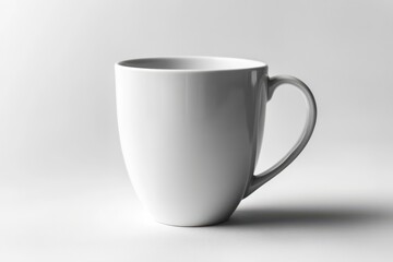 Fototapeta premium White ceramic coffee mug with smooth glossy finish isolated on white background