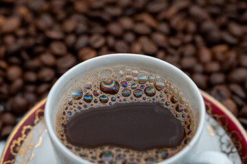 cup of Turkish coffee with beans close up