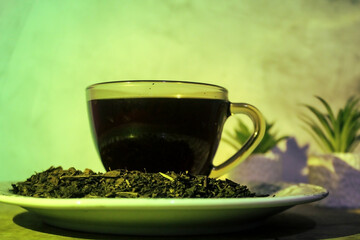 A hot cup of tea in a quiet, low-lit room.