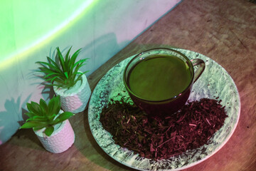 A hot cup of tea in a quiet, low-lit room.