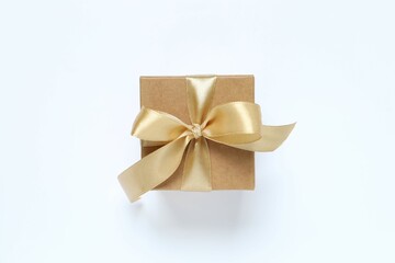 Beautiful gift box tied with bow on white background 