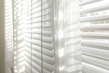 A detailed view of a window with white blinds, perfect for interior design or architecture images