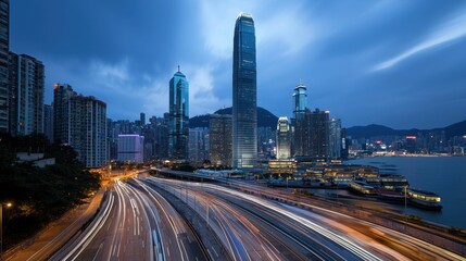 Fototapeta premium A city skyline with a large building in the middle