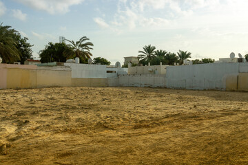Naklejka premium Arab residential area behind high fences. Empty unclaimed space