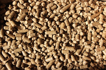 Wood pellet background. Close up natural wood pellet. Ecological heating, renewable energies Biofuels. 