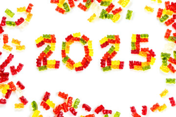 2025 made from colorful gummy bears and more gums around, sweet Happy New Year greeting card, isolated with small shadows on a white background