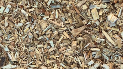 CloseUp View of Natural Wood Chips for Mulch or Fuel.Detailed close-up of natural wood chips,ideal...