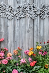Fototapeta premium Gray wood fence, carved flowers, colorful blooms.