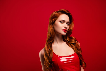 Naklejka premium Photo of pretty stunning girl look camera teasing wear sexy leather outfit isolated on red color background