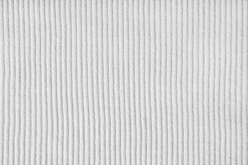 Jersey textile background , white striped ridge tricot fabric. Cotton stockinet, pullover surface texture, textile structure, cloth surface, weaving of knitwear material. Wallpaper, backdrop.