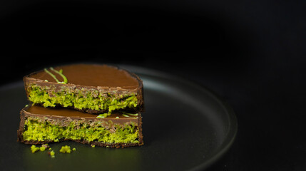 Dubai Chocolate on Black Stylish Plate on Dark Background, Copy Space, banner