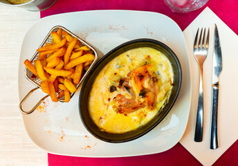 Popular dish of French cuisine is the escalope Savoyard, made from layers of meat, mushrooms, soft Reblochon cheese, ham and ..traditional cream-fresh, served with French fries