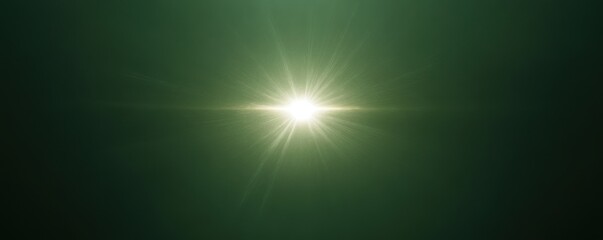 Obraz premium Bright starburst light effect with radiant beams on a dark green background