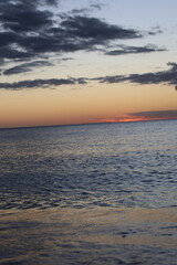 Obraz premium sunset over the ocean evening on sea with small waves