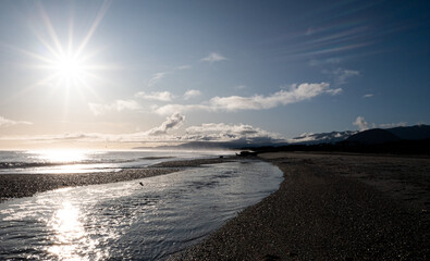 Picturesque beach with small waves sea foam new zealand west coast