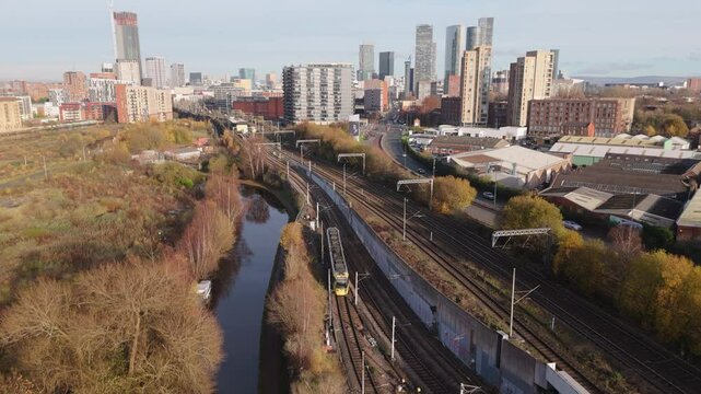 	
Aerial view of trams in Manchester, United Kingdom going along track. Public transportation concept