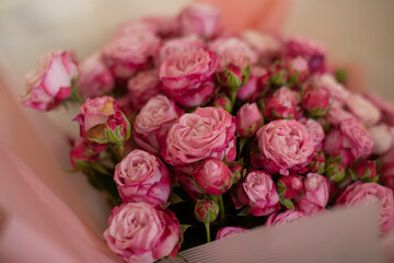 A close-up of a vibrant bouquet of pink roses, showcasing their delicate petals and natural beauty. Perfect for themes of love, romance, celebrations, or floral arrangements.
