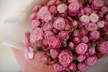 A close-up of a vibrant bouquet of pink roses, showcasing their delicate petals and natural beauty. Perfect for themes of love, romance, celebrations, or floral arrangements.