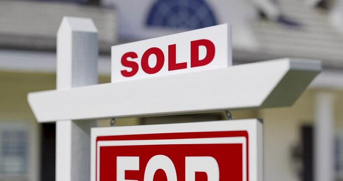 4k Slow Dramatic Pan of Sold For Sale Real Estate Sign in Front of New House.
