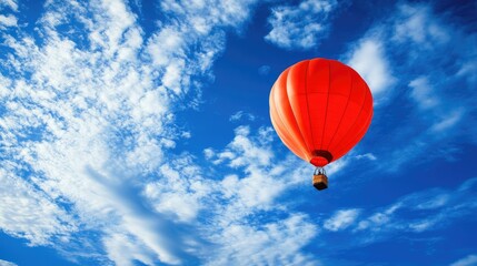 Fototapeta premium Red Balloon Rising into Blue Sky