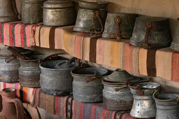 Rustic metal pots on display in a old turkish house,