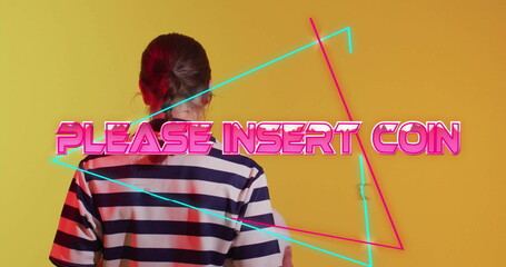 PLEASE INSERT COIN text image over person in striped shirt facing yellow background