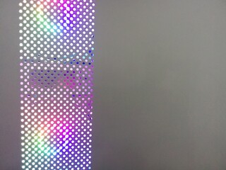 The holes in the wall of the computer box reveal the colorful lights inside to create an attractive...