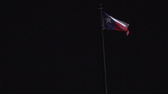 Texas Flag waving at night in Austin, Texas 11/28/2024