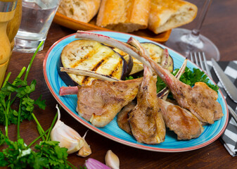 Baked lamb ribs served with grilled aubergine and fresh parsley