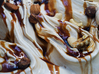 Delicious Creamy Swirls Topped with Nuts and Syrup