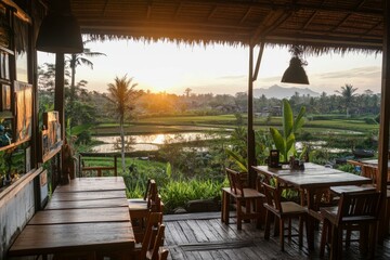 Fototapeta premium a food stall in a village area in a rice paddy area with sunset