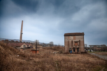 Fototapeta premium A panoramic view of an abandoned brick factory in Eastern Europe, specifically in Serbia, illustrating the remnants of industrialization and the effects of economic transition in the region.