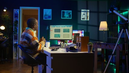 African American man having discussion during online meeting on laptop, talking about internet...