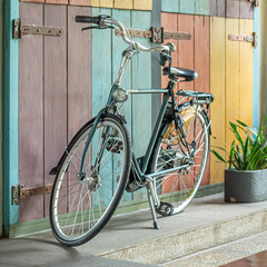 An antique bicycle displayed in a room in a restaurant is one of the attractive decorations for customers