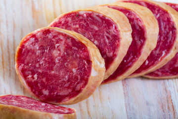 Close up of traditional Spanish dried pork sausage Salchichon