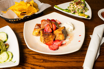 Churro French toast with berries and cream