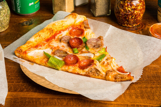 Meat lovers pizza slice