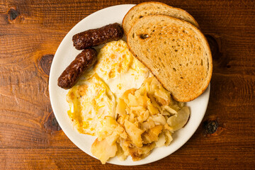 Sausage, fried eggs and potatoes