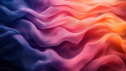 Obraz premium A vibrant, flowing fabric with rich colors blends from deep blue to warm orange, showcasing elegant patterns and textures.