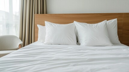 A serene bedroom scene featuring a neatly made bed with fluffy white pillows against a warm wooden headboard and soft curtains.