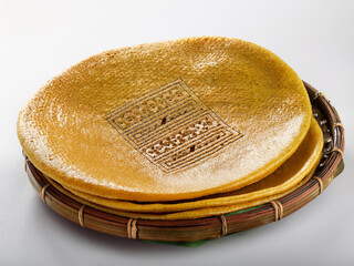 Ethiopian doro wat with injera on a white background