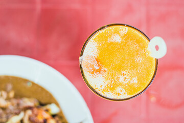 Flat view of fresh drink, mango juice