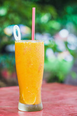 Mango juice with blurred background