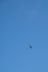 Helicopter brings water bomb.
