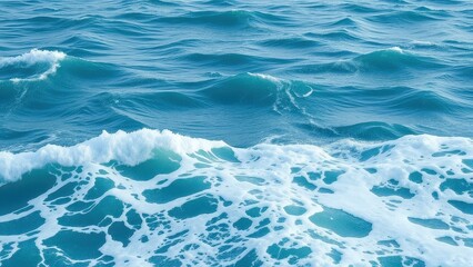 Obraz premium Ocean surf with foamy white water and wavy surface of blue turquoise ocean, sea foam, wave patterns, ocean surf